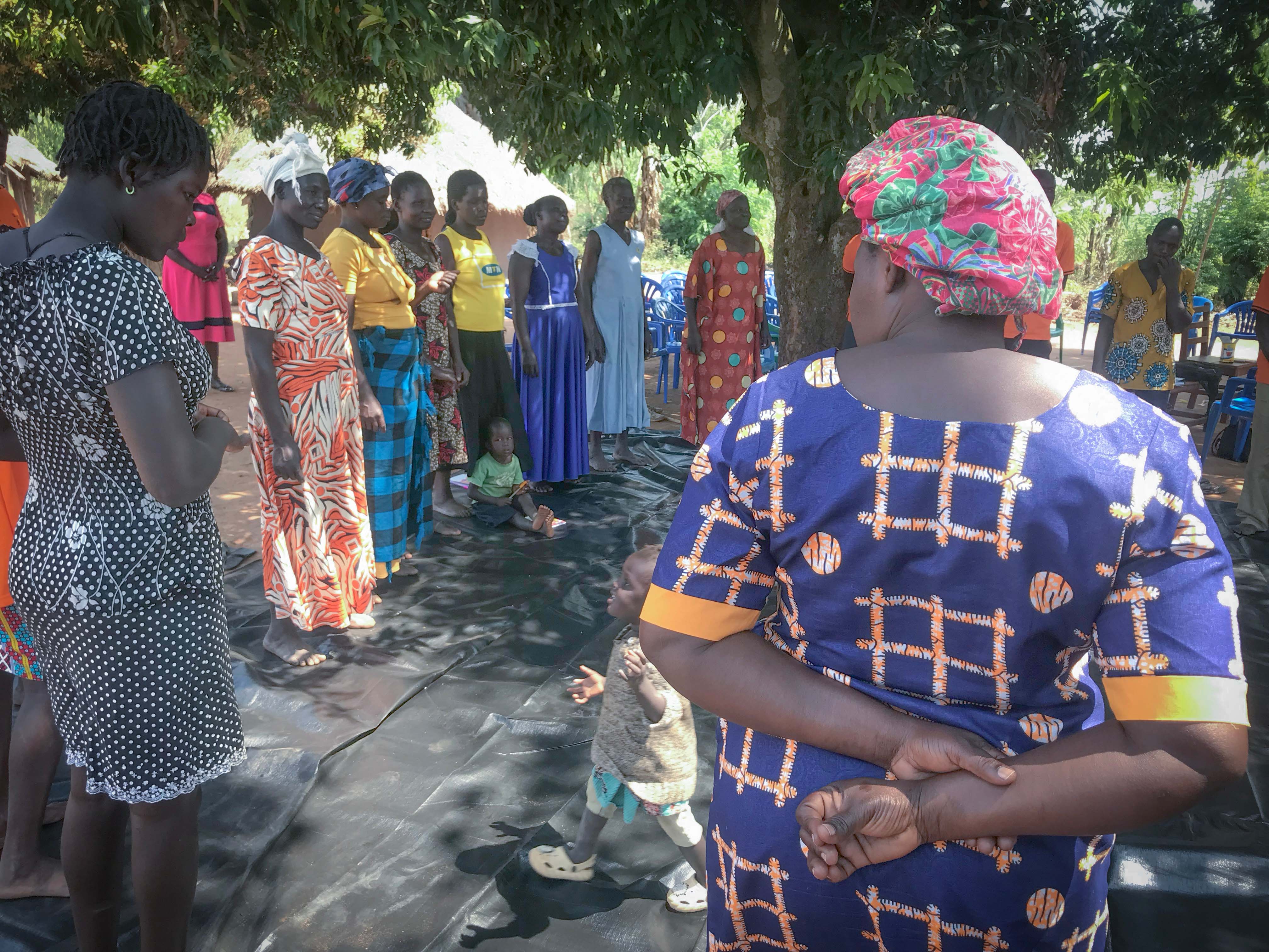 Empowered women participants meditating during an RFW program